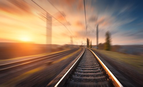 Railroad,In,Motion,At,Sunset.,Railway,Station,With,Motion,Blur